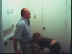 Hidden webcam video with a wench engulfing my boss's prick in the washroom